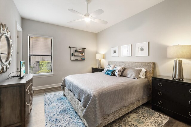 bedroom featuring hardwood / wood-style floors and ceiling fan