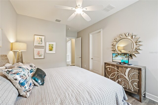 bedroom with ceiling fan and wood-type flooring