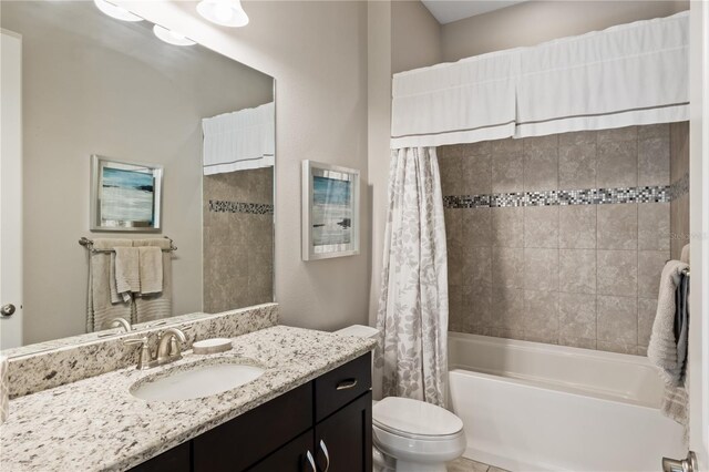 full bathroom featuring vanity, toilet, and shower / tub combo with curtain