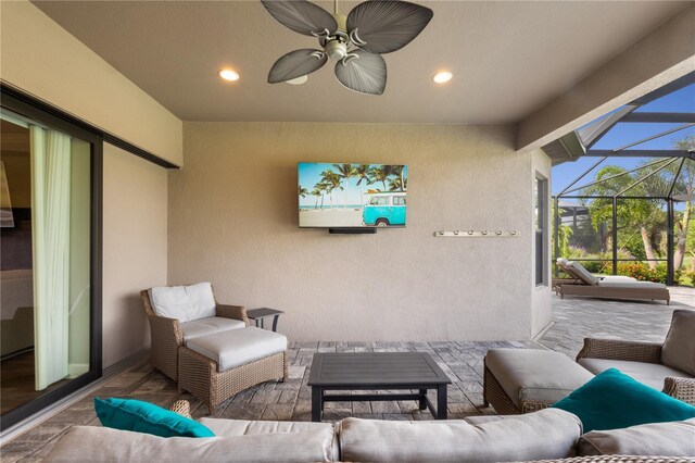 view of patio with an outdoor living space and a lanai