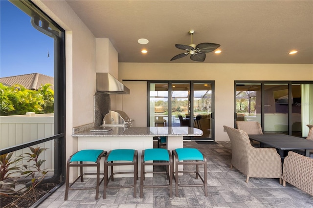 view of patio / terrace featuring ceiling fan and grilling area