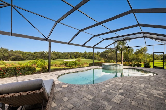 view of swimming pool featuring a lanai, an in ground hot tub, and a patio area