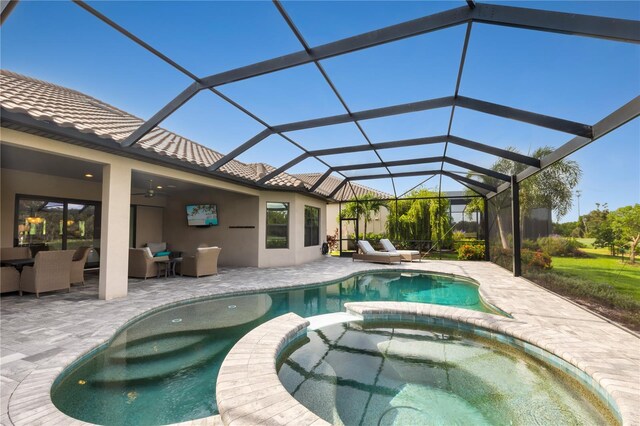 view of pool with glass enclosure, an outdoor living space, a patio, and an in ground hot tub