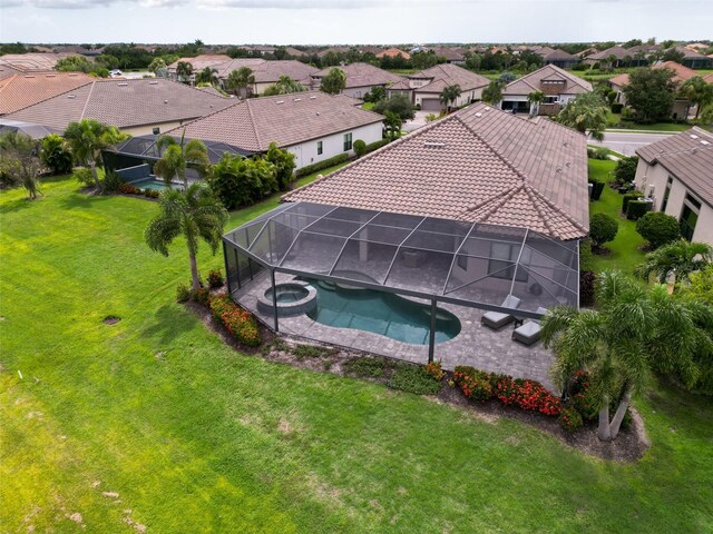 view of pool featuring a yard and a lanai