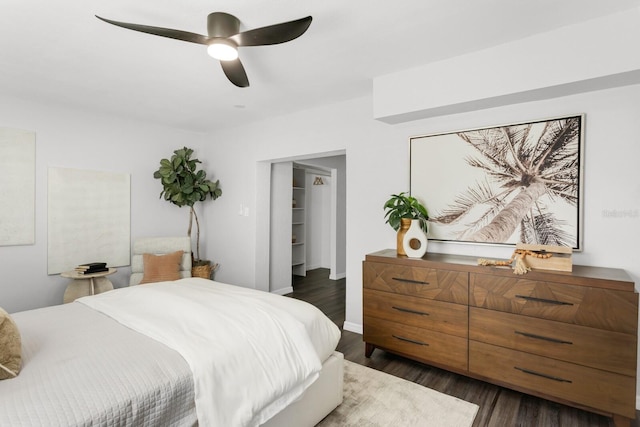 bedroom featuring ceiling fan and dark hardwood / wood-style floors