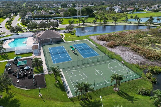 birds eye view of property featuring a water view