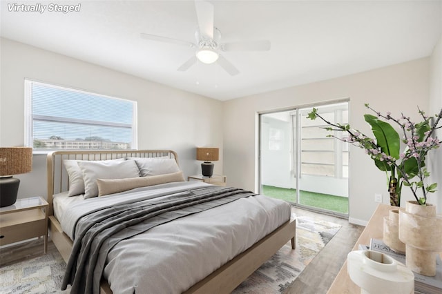 bedroom with a closet, ceiling fan, and light hardwood / wood-style flooring