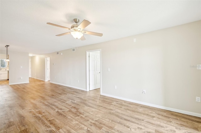 interior space with light wood-type flooring and ceiling fan