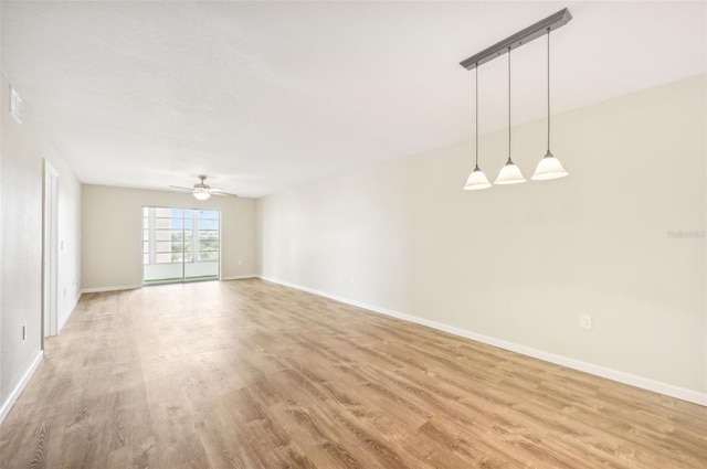 unfurnished room featuring ceiling fan and light wood-type flooring