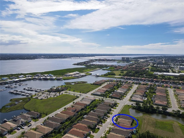 birds eye view of property with a water view