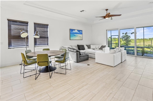 living room featuring ceiling fan and crown molding