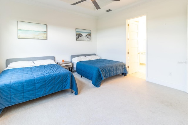 bedroom with ceiling fan, ornamental molding, and ensuite bathroom