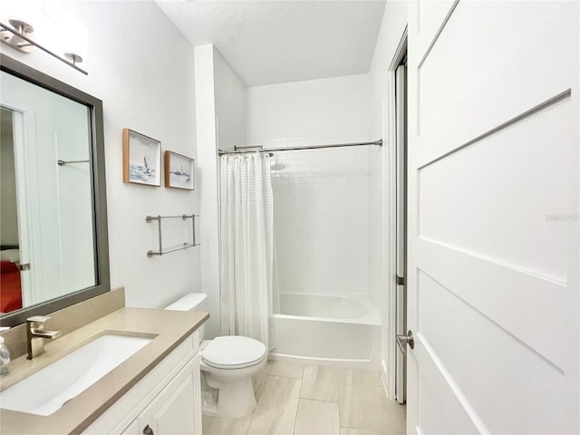 full bathroom with toilet, shower / tub combo with curtain, and vanity