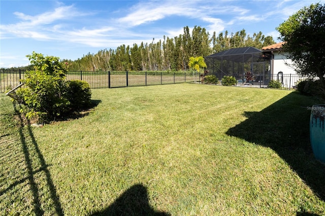 view of yard featuring glass enclosure