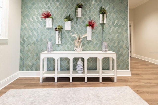 interior space with crown molding and hardwood / wood-style flooring