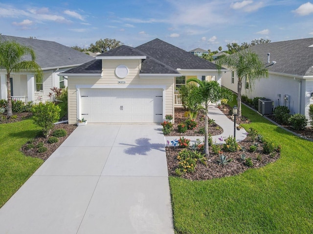 single story home featuring a front yard, cooling unit, and a garage