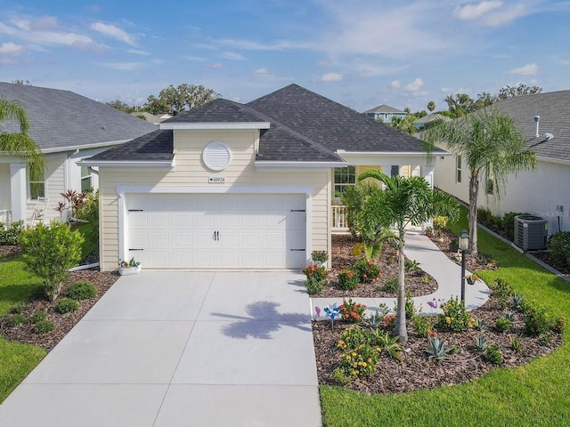 single story home featuring a garage and central AC