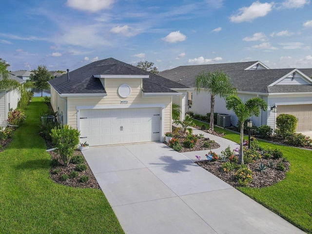 ranch-style house with a garage, a front lawn, and central AC unit