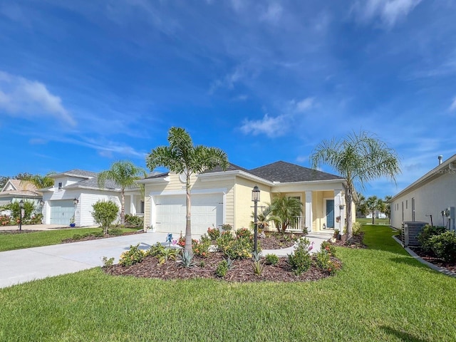 view of front of property with a garage, a porch, a front lawn, and central air condition unit