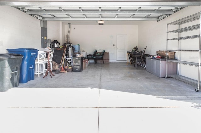 garage featuring a garage door opener and electric panel