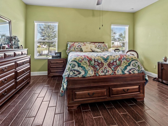 bedroom featuring ceiling fan and dark hardwood / wood-style flooring