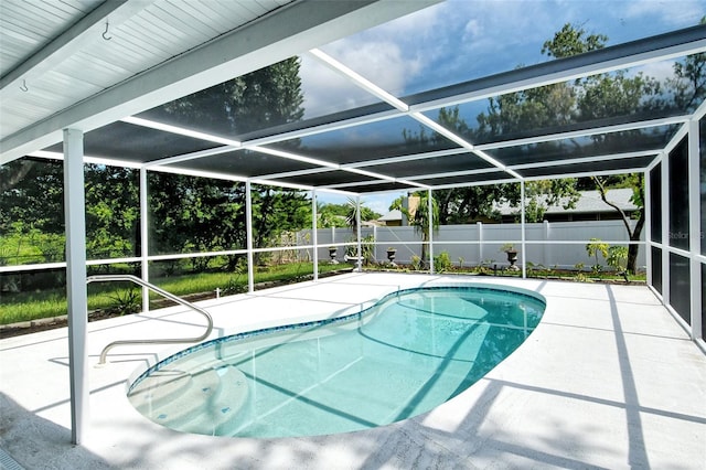 view of swimming pool featuring a patio area, a fenced in pool, a lanai, and a fenced backyard