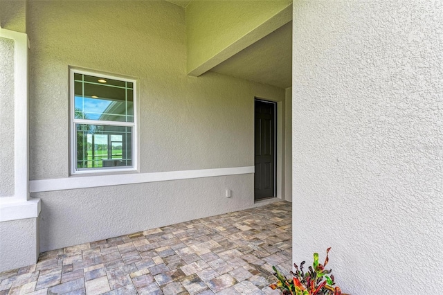 property entrance featuring a patio area