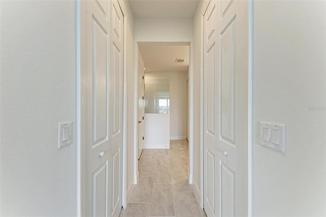4254 Golden Creek Ter, Parrish, FL 34219 - hall featuring light tile patterned floors and baseboards