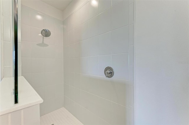 bathroom with a tile shower