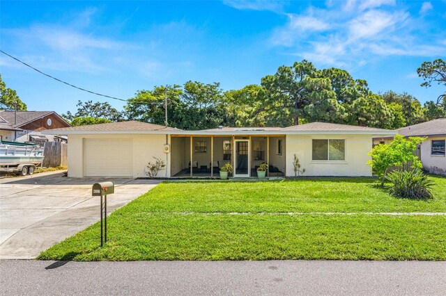 ranch-style house with a garage and a front yard