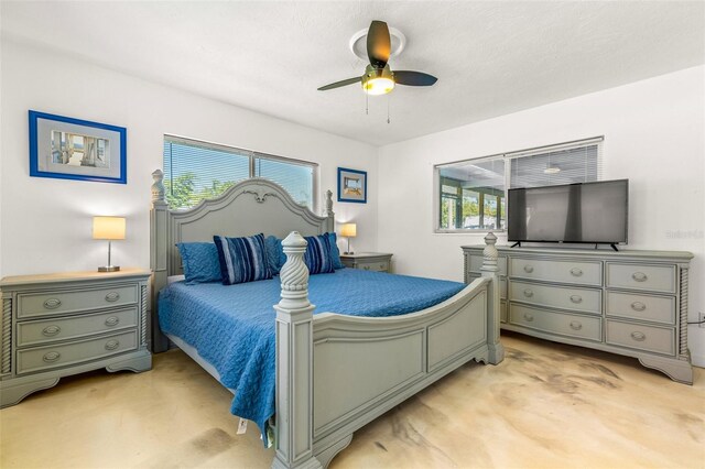 bedroom featuring light colored carpet and ceiling fan