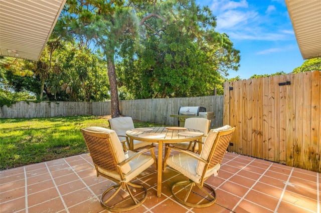 view of patio with a grill