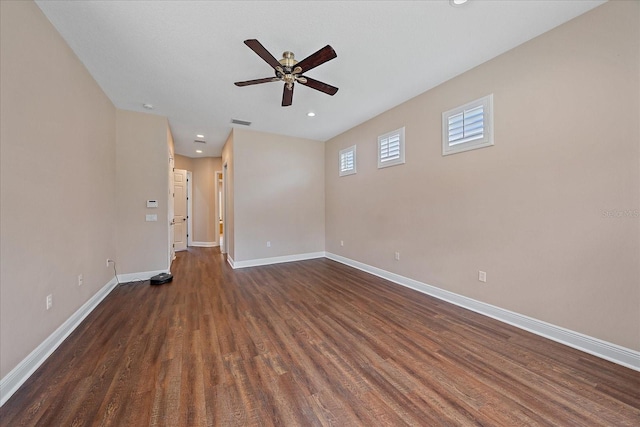 unfurnished room with ceiling fan and dark hardwood / wood-style floors