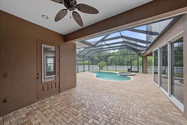 view of swimming pool featuring ceiling fan