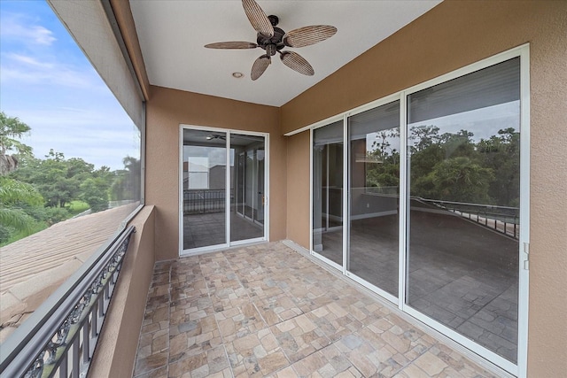 balcony featuring ceiling fan