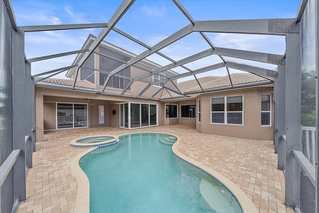 view of swimming pool featuring a lanai and a patio