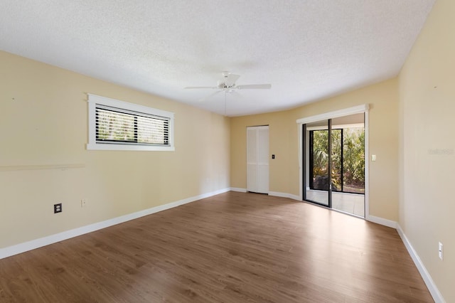 3601 Quail Hollow Ln, Bradenton, FL 34210 - unfurnished room with wood finished floors, a ceiling fan, a textured ceiling, and baseboards
