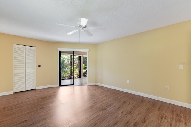 3601 Quail Hollow Ln, Bradenton, FL 34210 - empty room with wood finished floors, ceiling fan, and baseboards