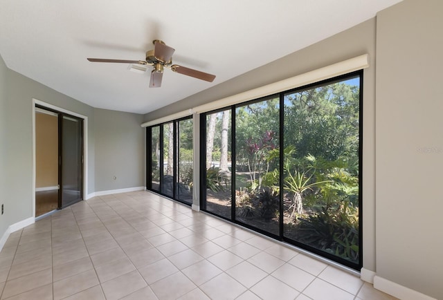 3601 Quail Hollow Ln, Bradenton, FL 34210 - tiled empty room with healthy amount of natural light, ceiling fan, and baseboards