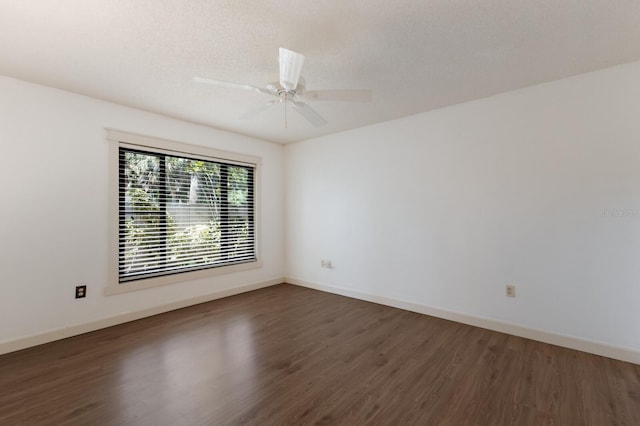 3601 Quail Hollow Ln, Bradenton, FL 34210 - empty room featuring dark wood-type flooring, baseboards, and ceiling fan