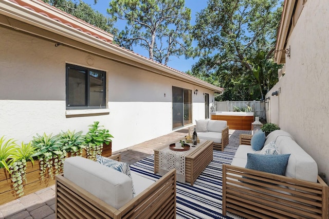 3601 Quail Hollow Ln, Bradenton, FL 34210 - view of patio featuring an outdoor living space, a hot tub, and fence