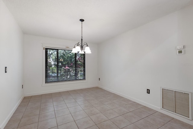 3601 Quail Hollow Ln, Bradenton, FL 34210 - spare room featuring a chandelier and light tile patterned floors