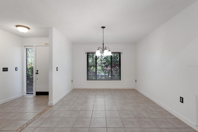 3601 Quail Hollow Ln, Bradenton, FL 34210 - unfurnished dining area with a chandelier and light tile patterned floors
