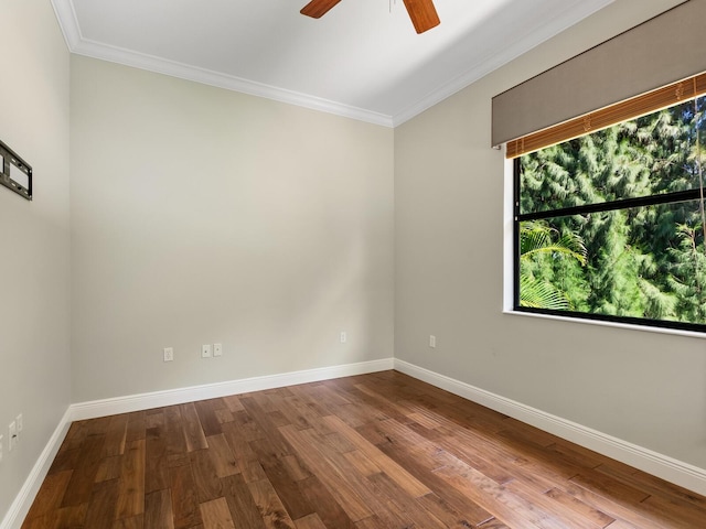 empty room featuring crown molding, hardwood / wood-style floors, and ceiling fan