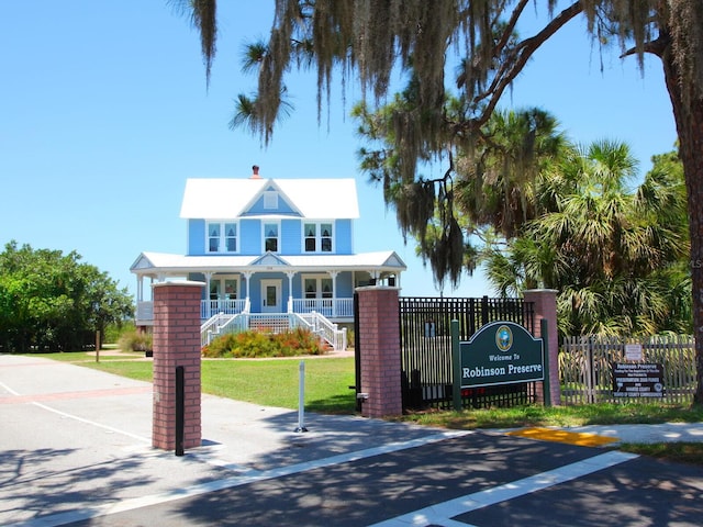 exterior space featuring decorative columns