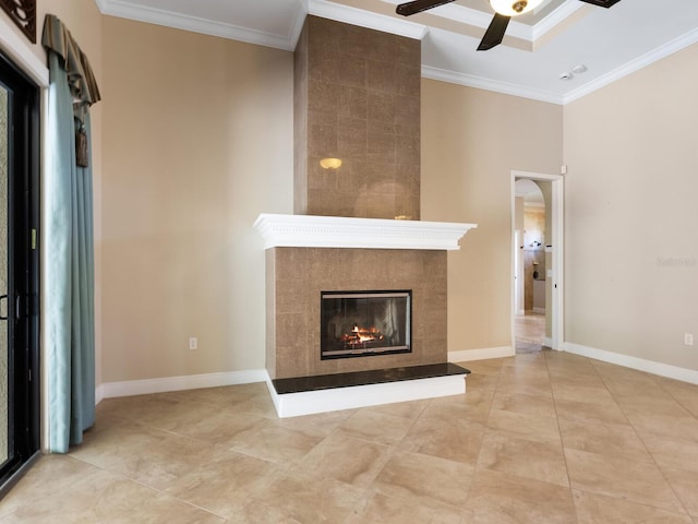 unfurnished living room with ceiling fan, crown molding, and a fireplace