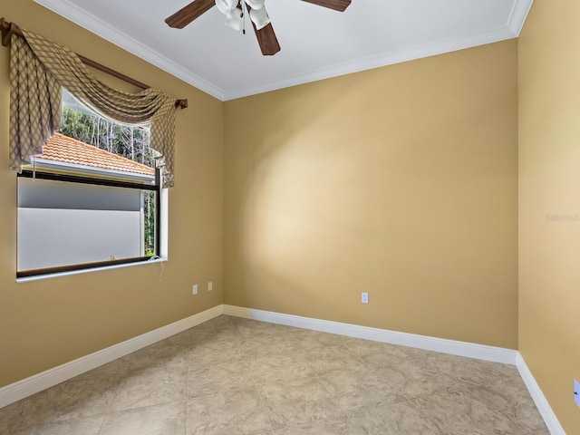 spare room featuring ceiling fan and ornamental molding