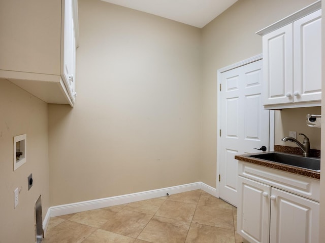 laundry area with electric dryer hookup, cabinets, sink, and washer hookup