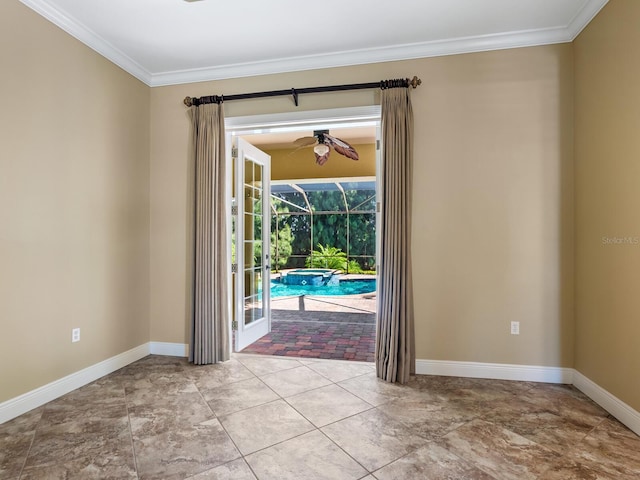 interior space with ceiling fan and ornamental molding