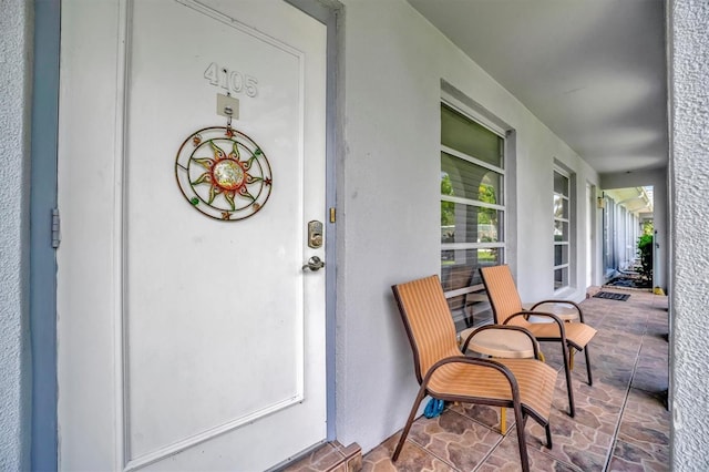 doorway to property with covered porch